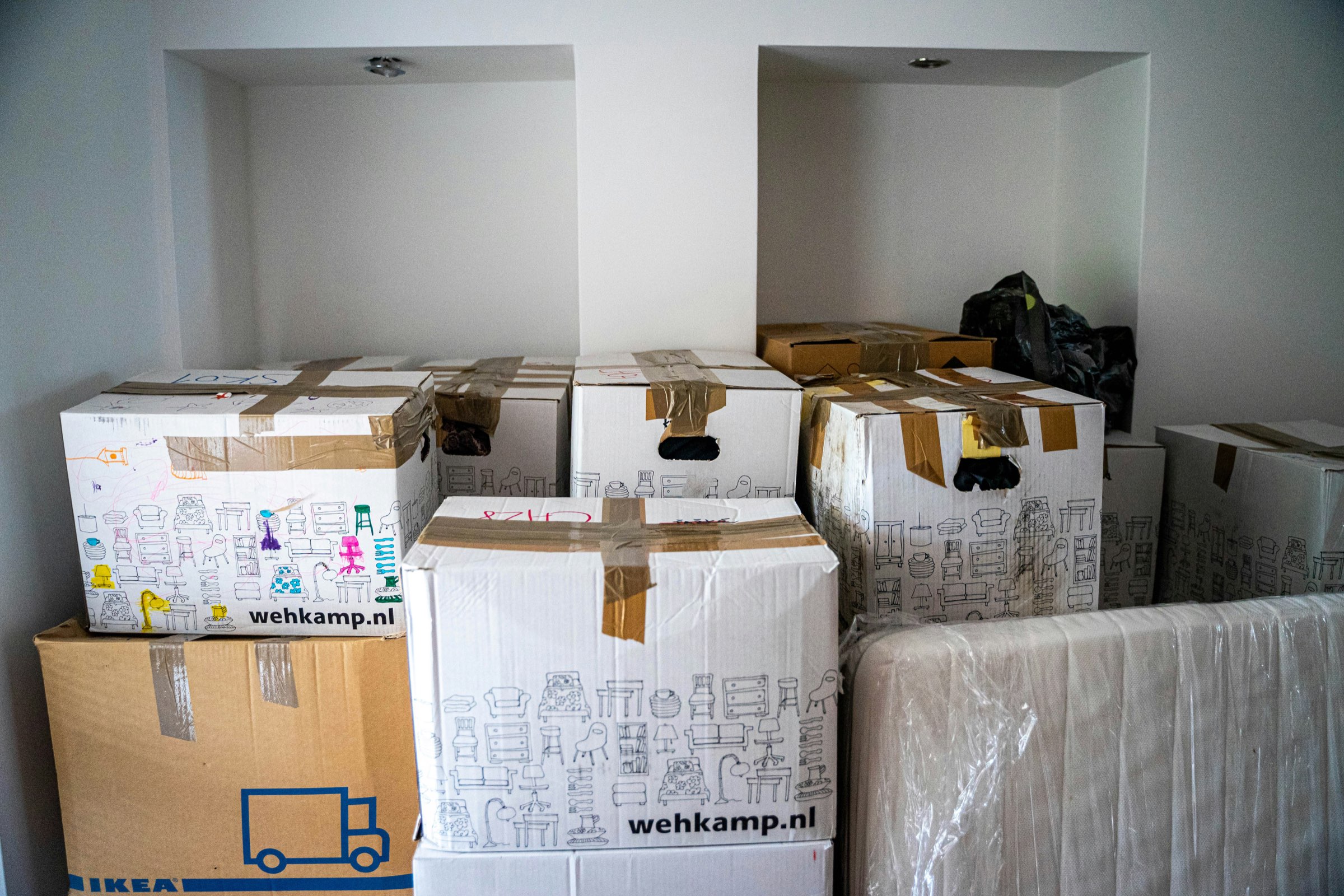 A room stacked with moving boxes