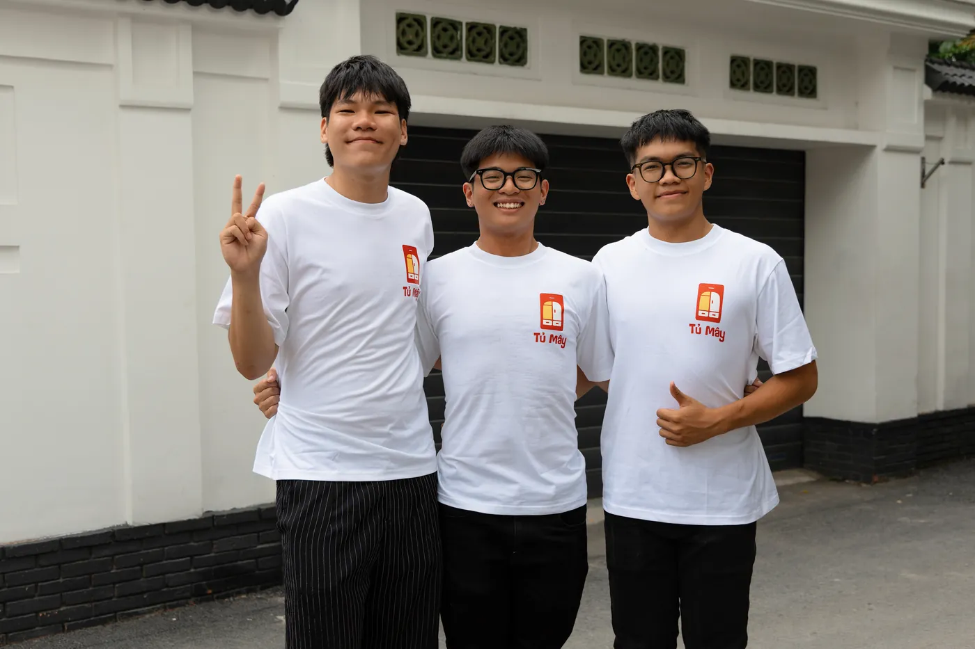 The Tủ Mây collection crew outside a house in Ho Chi Minh City